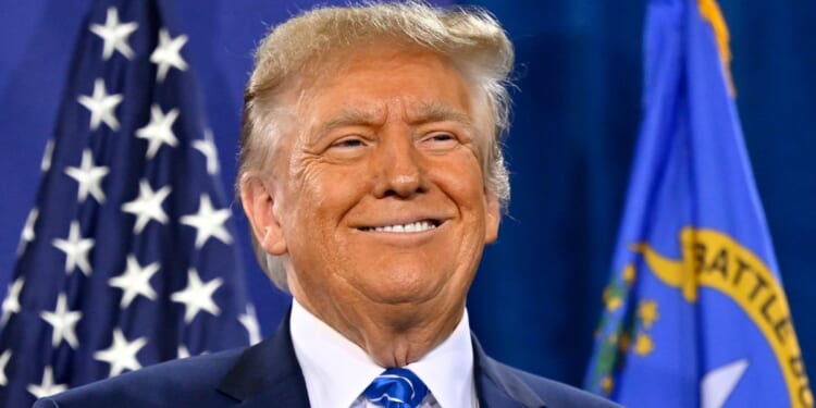 Republican presidential candidate and former President Donald Trump smiles during a campaign event at Big League Dreams in Las Vegas on Saturday.