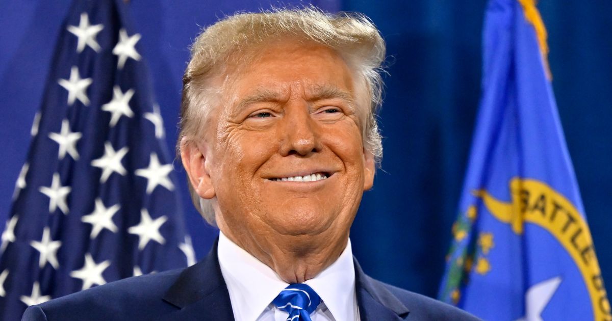 Republican presidential candidate and former President Donald Trump smiles during a campaign event at Big League Dreams in Las Vegas on Saturday.