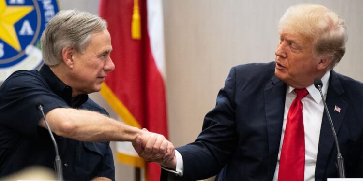 Gov. Greg Abbott and former President Donald Trump shaking hands