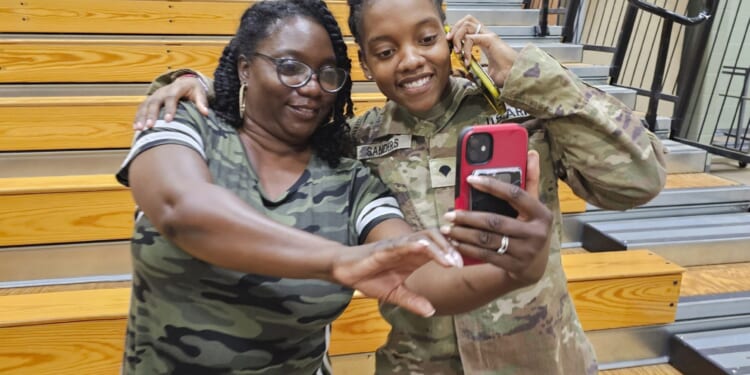 Army Spc. Kennedy Sanders, right, poses for a photo with her mother, Oneida Oliver-Sanders, at a ceremony in Columbus, Georgia, on Aug. 9.