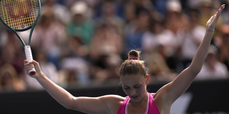 Without handshakes, Ukrainian players trying to keep message alive at Australian Open