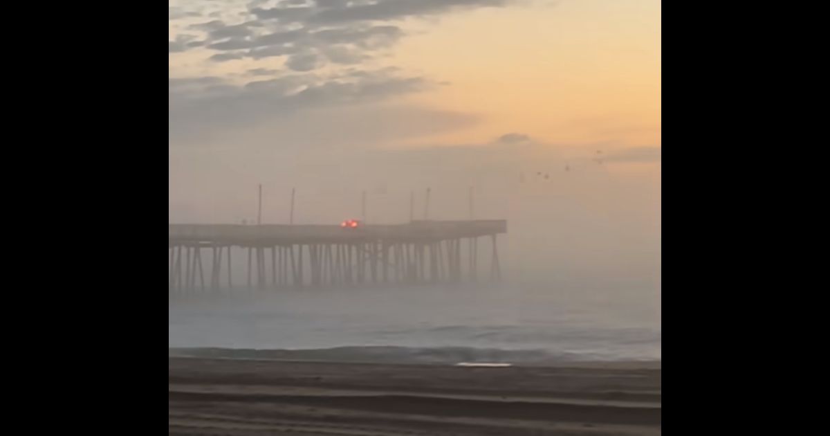 An SUV is driven off the end of the pier in Virginia Beach, Virginia, on Saturday morning.