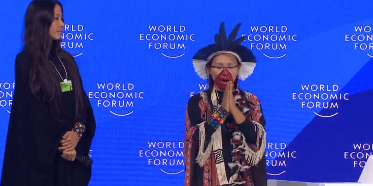 Chief Putanny Yawanawá of Brazil's Yawanawá Tribe performs a ritual at the WEF meeting in Davos.