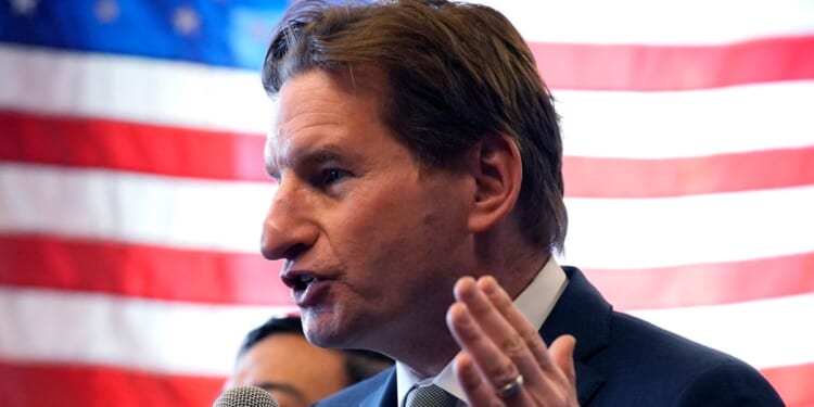 Democratic presidential candidate Rep. Dean Phillips of Minnesota gestures during a campaign stop in Manchester, New Hampshire, on Thursday.