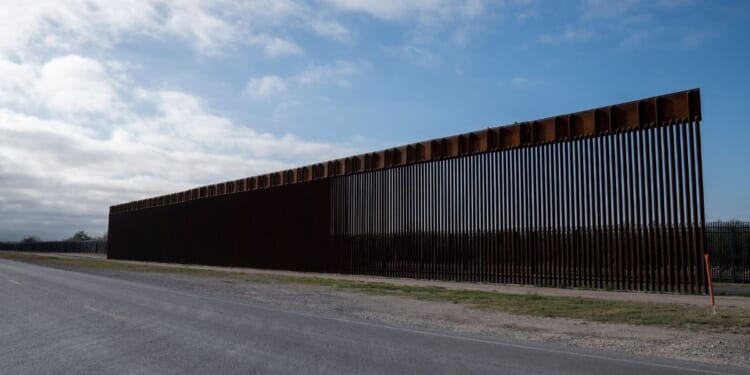 A segment of the new border wall is seen in front of the older border wall in Del Rio, Texas on March 5, 2023.