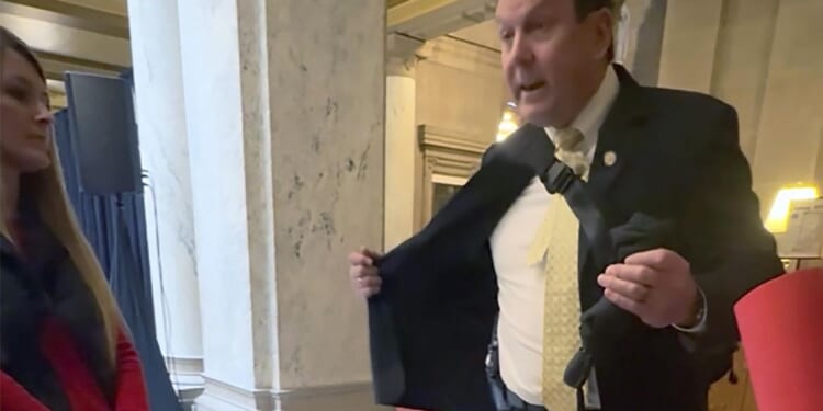 Indiana Rep. Jim Lucas shows holstered gun to students advocating for gun control