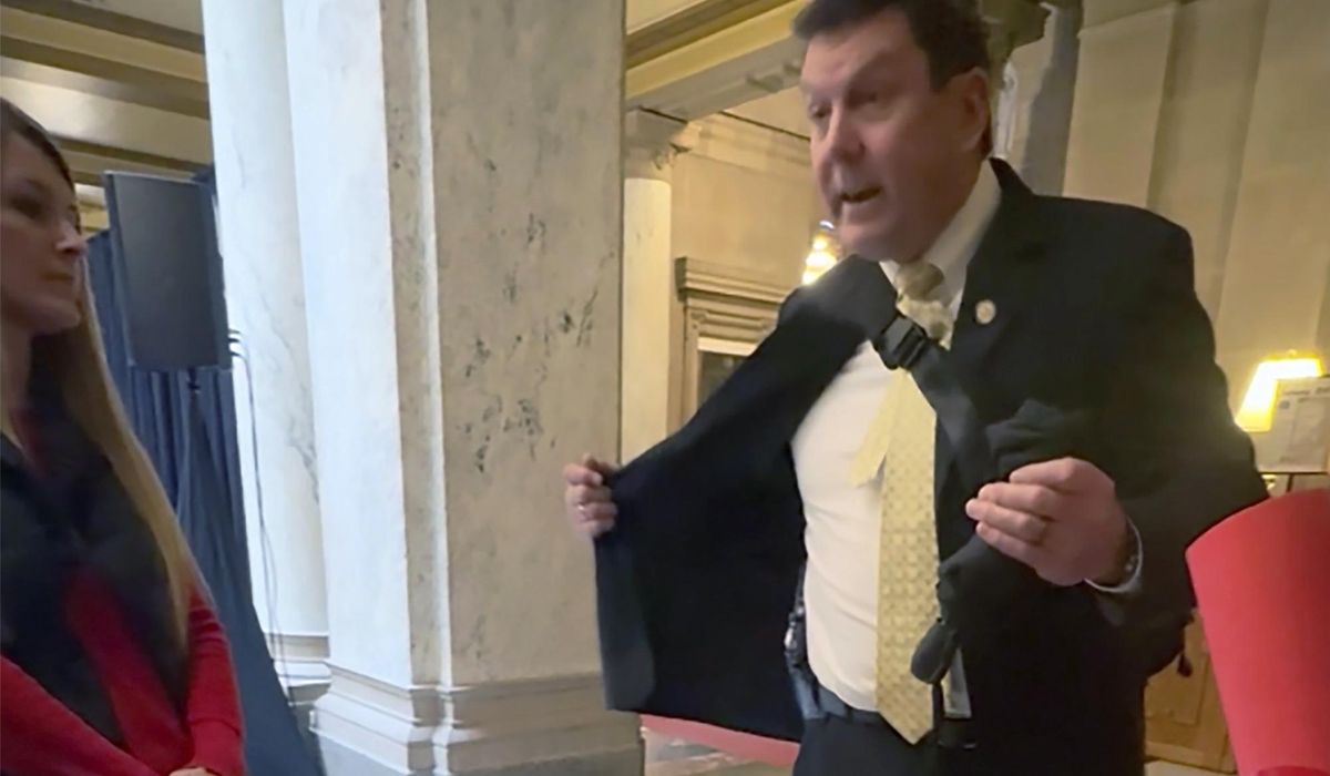 Indiana Rep. Jim Lucas shows holstered gun to students advocating for gun control