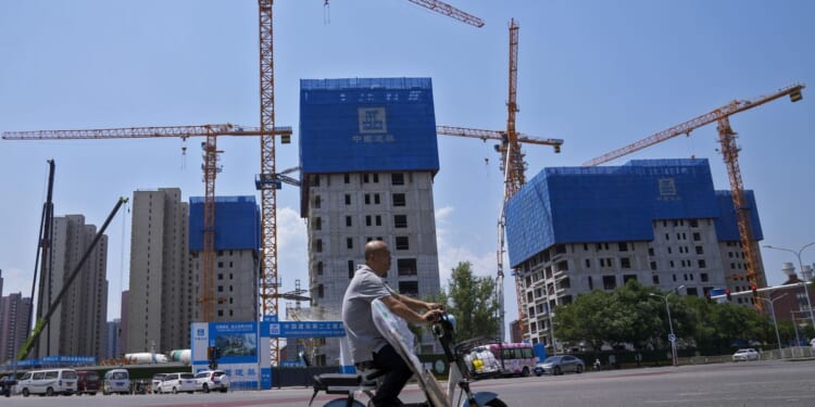 China pledges more help for its ailing property market, as IMF forecasts economy will slow