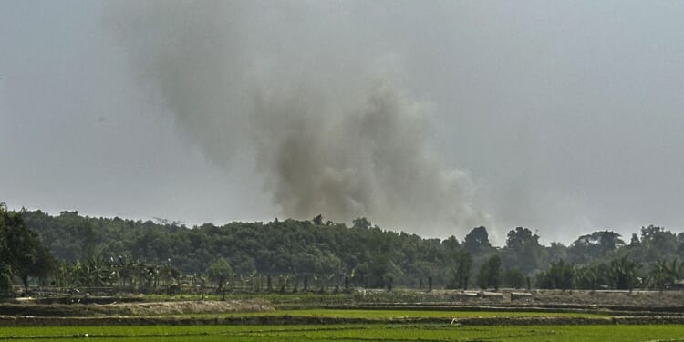 Myanmar government forces flee into Bangladesh during fighting with an ethnic armed group