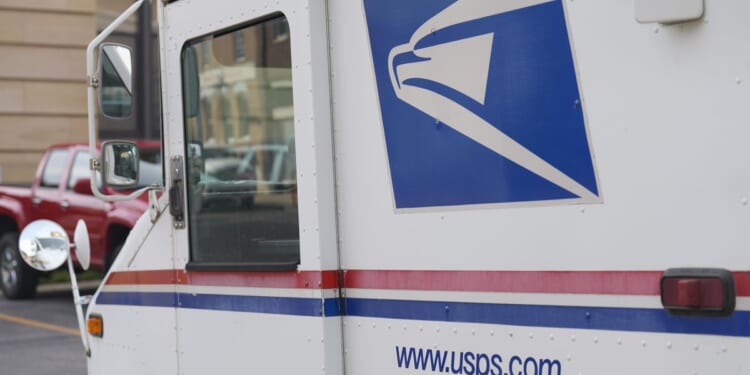 Postal Service, once chided for slow adoption of EVs, announces plan to cut greenhouse gas emissions