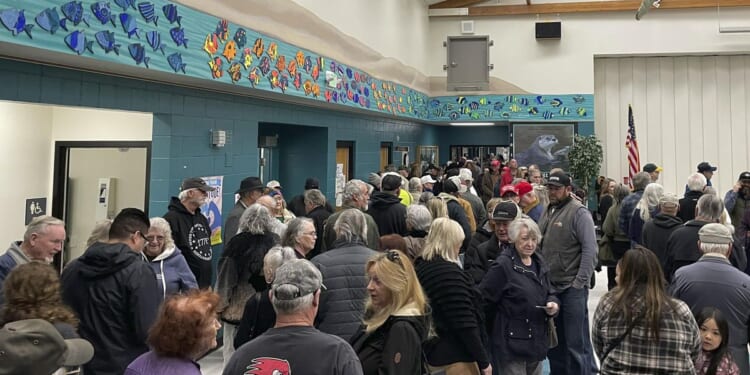 Nevada Republicans wait in long lines to caucus for Donald Trump, who is expected to win