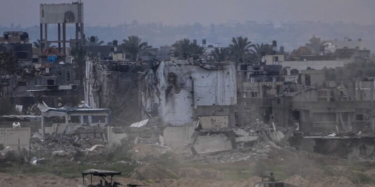 Displaced Palestinians leave one of Gaza's main hospitals after weeks of being isolated by fighting