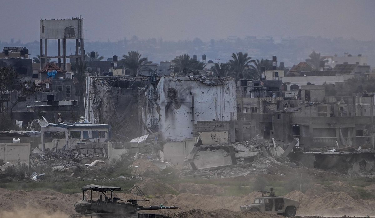 Displaced Palestinians leave one of Gaza's main hospitals after weeks of being isolated by fighting