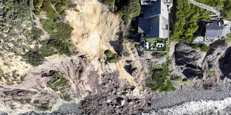 Massive landslide on coastal bluff leaves Southern California mansion on the edge of a cliff