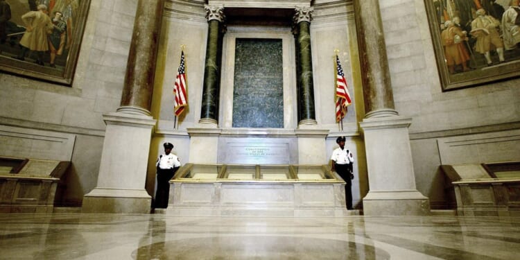 Climate activists arrested for dumping red powder on U.S. Constitution display at National Archives