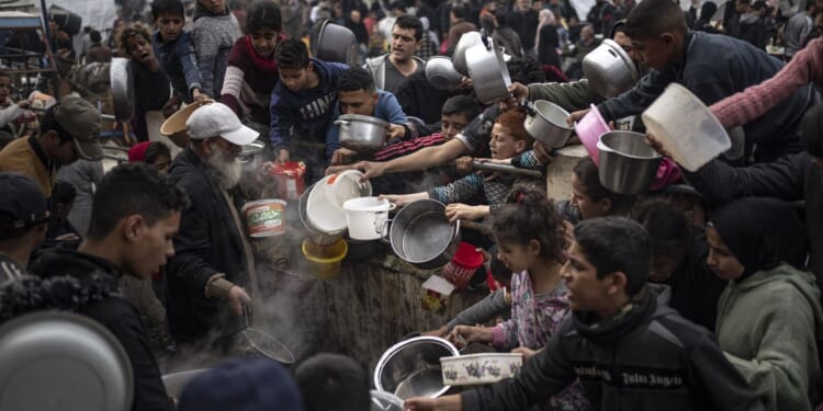 Palestinian deaths in Gaza pass 30,000 as witnesses say Israeli forces fire on crowd waiting for aid