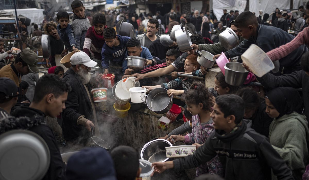 Palestinian deaths in Gaza pass 30,000 as witnesses say Israeli forces fire on crowd waiting for aid