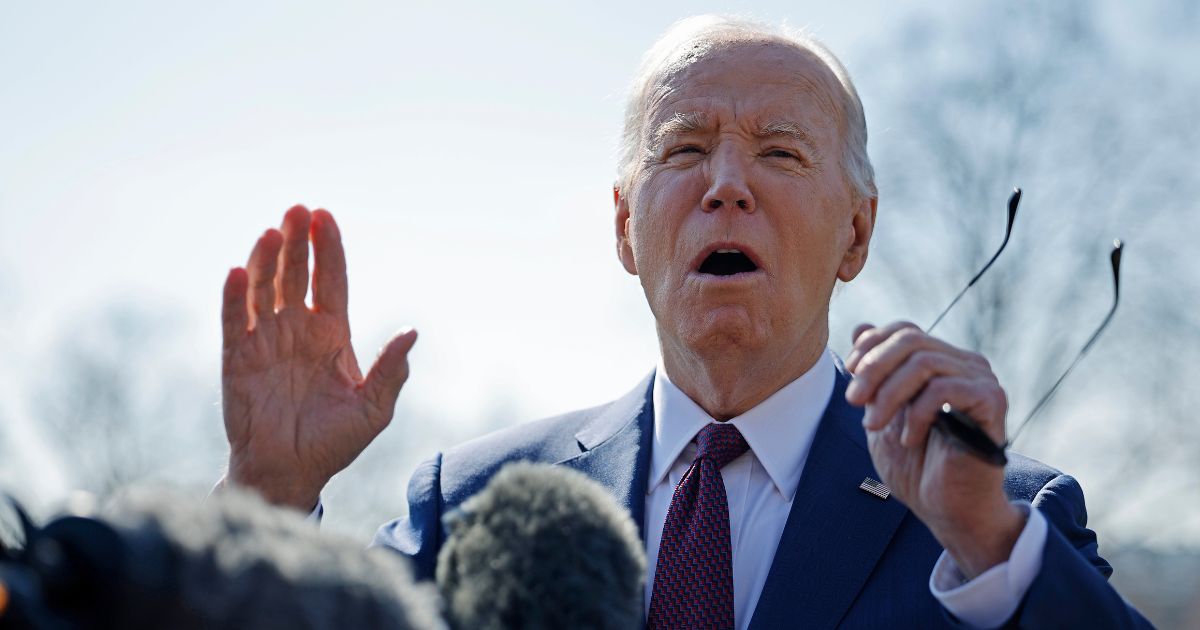 President Joe Biden talks to reporters as he departs the White House in Washington on Tuesday.