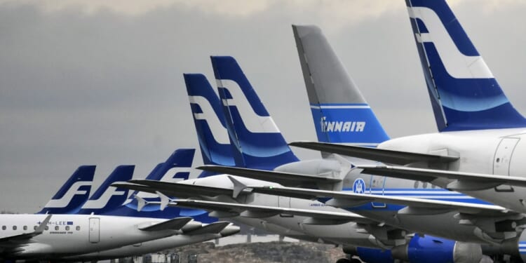 Passenger planes of the Finnish national airline carrier, Finnair, sit on the tarmac at Helsinki Airport in 2009.