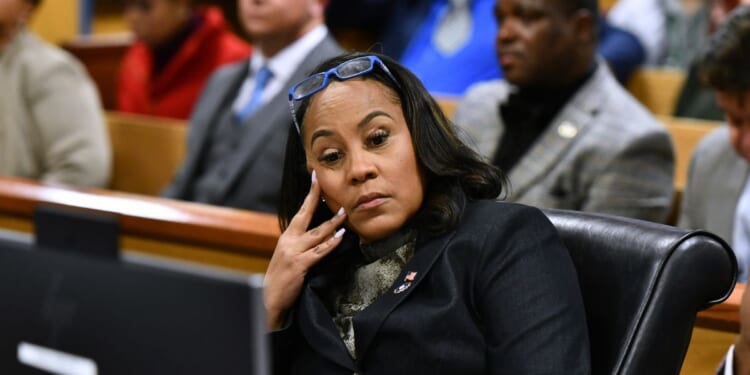 Fulton County District Attorney Fani Willis appears before Judge Scott McAfee for a hearing in the 2020 Georgia election interference case at the Fulton County Courthouse in Atlanta on Nov. 21.