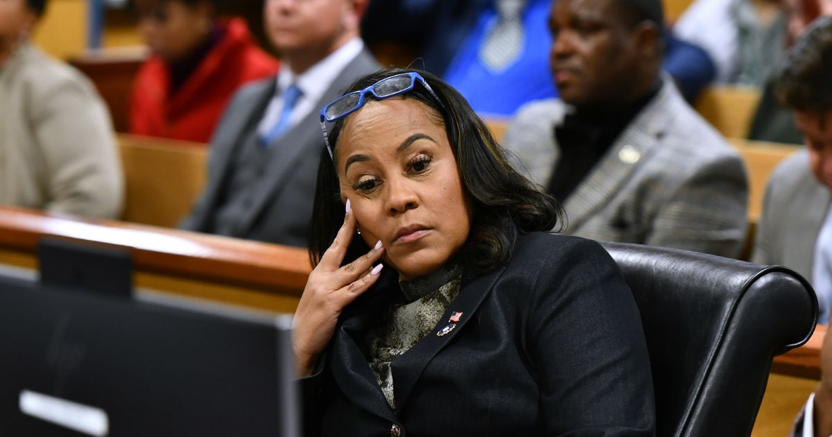 Fulton County District Attorney Fani Willis appears before Judge Scott McAfee for a hearing in the 2020 Georgia election interference case at the Fulton County Courthouse in Atlanta on Nov. 21.