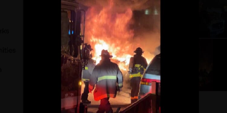 Firefighters on the scene Saturday night in San Francisco's Chinatown where an autonomous vehicle was set on fire by a crowd.