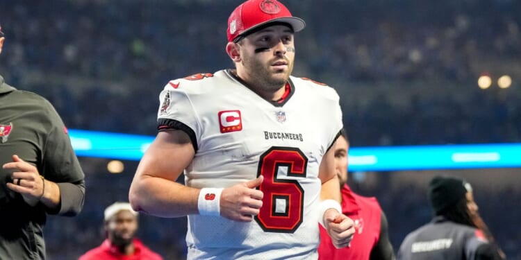 Tampa Bay Buccaneers quarterback Baker Mayfield runs off the field during the game against the Detroit Lions in Detroit, Michigan, on Jan. 21.