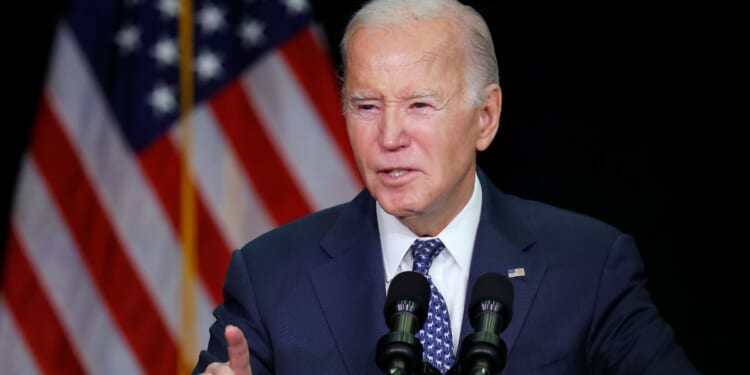 President Joe Biden speaks during the House Democrats' annual issues conference in Leesburg, Virginia, on Thursday.