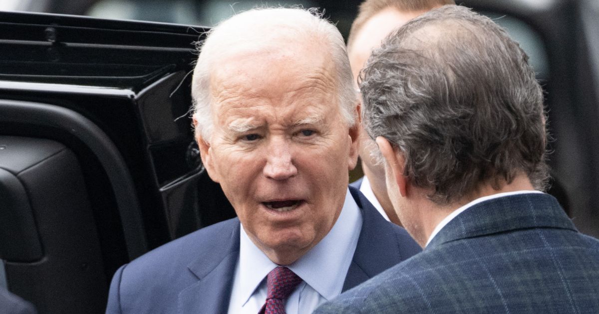 President Joe Biden talks to son Hunter Biden outside The Ivy restaurant in Los Angeles, California, on Sunday.