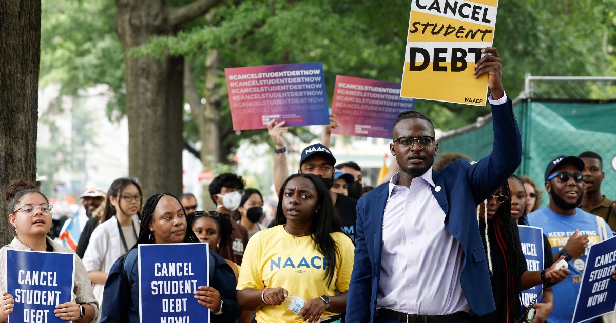 People for student debt relief demonstrate in front of the White House after the U.S. Supreme Court struck down President Biden's student debt relief program on June 30, 2023 in Washington, D.C.