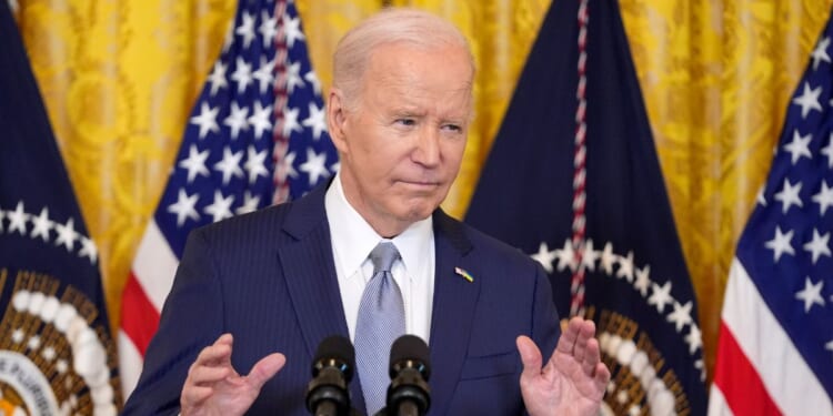 Joe Biden speaking in the East Room of the White House