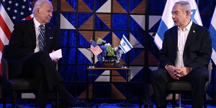 President Joe Biden, left, and Israel's Prime Minister Benjamin Netanyahu, right, speak prior to their statements and meeting in Tel Aviv, Israel, on Oct. 18.