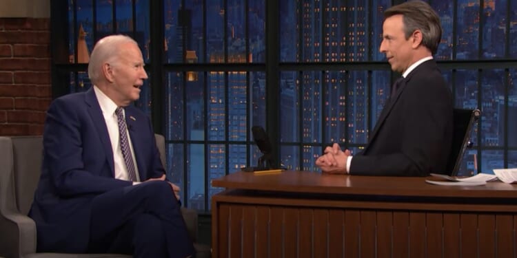 President Joe Biden talks to host Seth Meyers on NBC's "Late Night with Seth Meyers" on Monday.