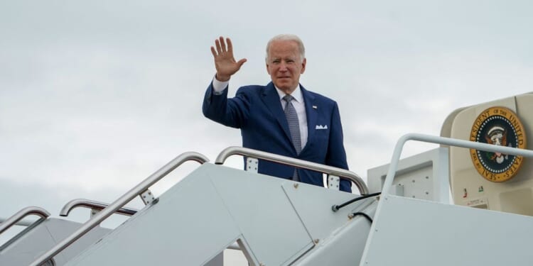 President Joe Biden boards Air Force One at Joint Base Andrews in Maryland in May 2022 as he departs for a weekend in Delaware. This week, aboard Air Force One after Biden's trip to Michigan, the appearance of pizza got people talking.