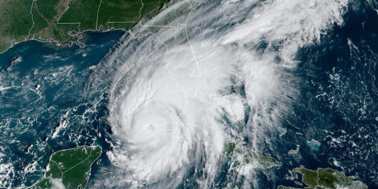 This GOES-East GeoColor satellite image taken at 9:56 a.m. EDT on Sept. 27, 2022, shows Hurricane Ian passing over western Cuba.