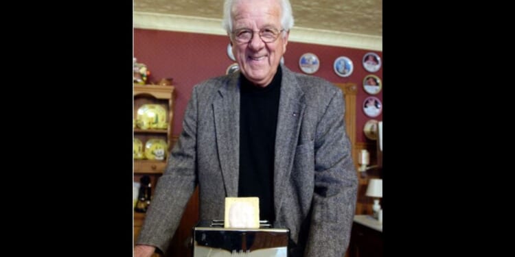 William Post poses with a Pop-Tart in 2003. Post, who played an important role in the development of the Pop-Tarts toaster pastry, died Saturday. He was 96.