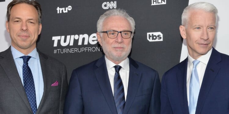 CNN stars Jake Tapper, left, Wolf Blitzer, and Anderson Cooper, seen at a 2016 event, may have salary cuts -- or even job changes -- in their future.