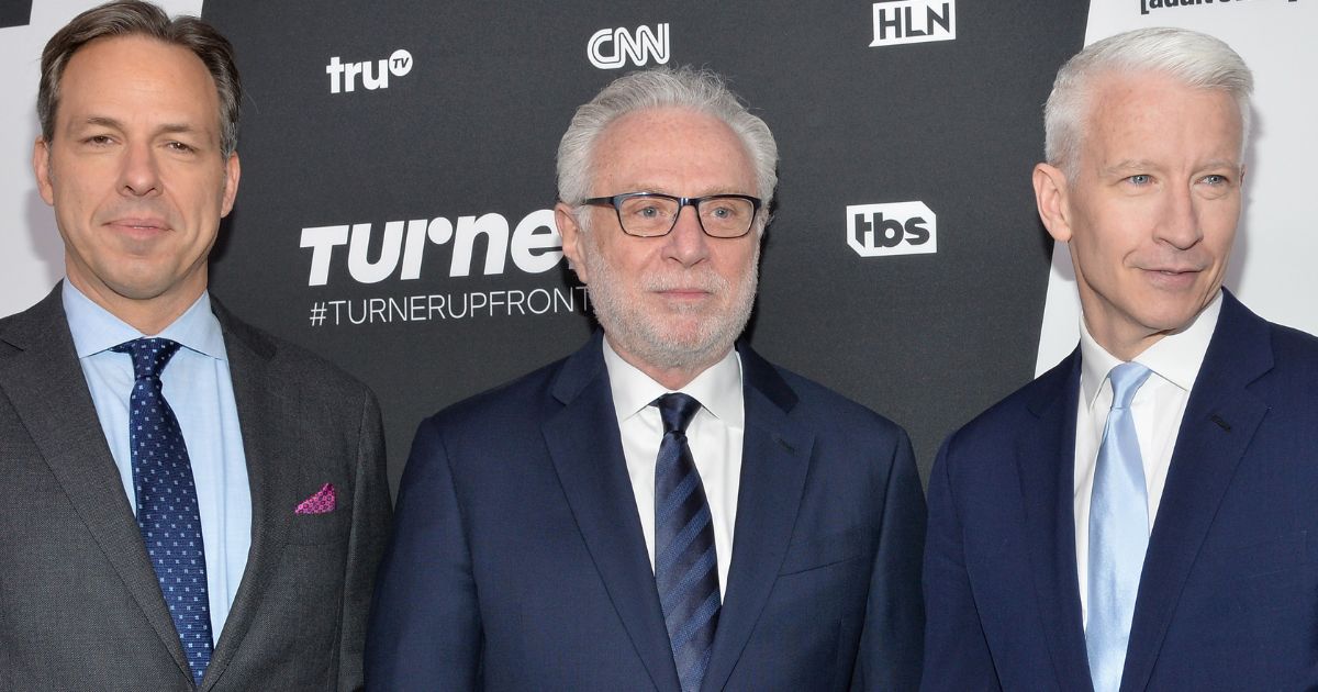 CNN stars Jake Tapper, left, Wolf Blitzer, and Anderson Cooper, seen at a 2016 event, may have salary cuts -- or even job changes -- in their future.