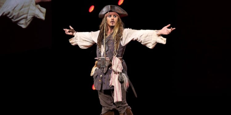 Actor Johnny Depp, dressed as Captain Jack Sparrow, of PIRATES OF THE CARIBBEAN: DEAD MEN TELL NO TALES took part today in "Worlds, Galaxies, and Universes: Live Action at The Walt Disney Studios" presentation at Disney's D23 EXPO 2015 in Anaheim, Calif.