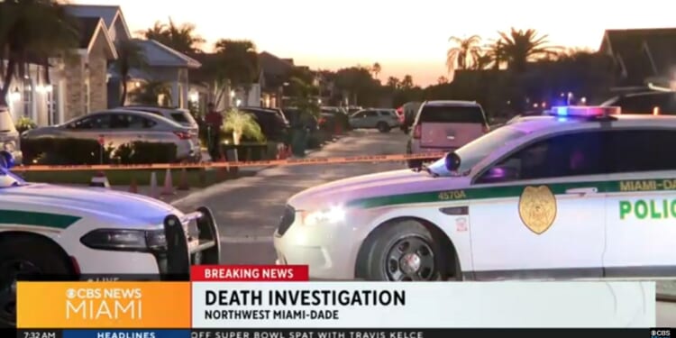 Investigators on the scene of a shooting in Miami early Wednesday where a car owner confronted two criminals.