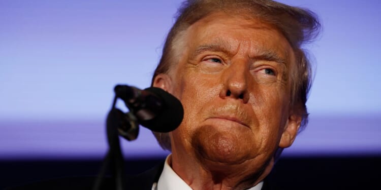 Republican presidential candidate and former President Donald Trump talks to supporters during a campaign rally at the Sheraton Portsmouth Harborside Hotel in Portsmouth, New Hampshire, on Jan. 17.