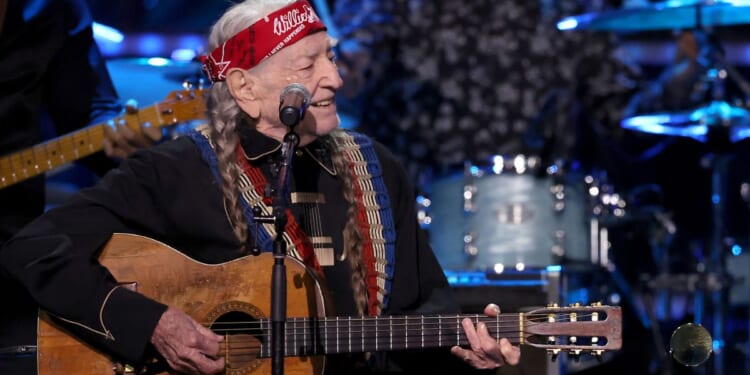 Willie Nelson performs onstage during the 38th Annual Rock & Roll Hall Of Fame Induction Ceremony in New York City on Nov. 3. Before a show in Seattle, Washington, on Tuesday Nelson's son was robbed of his equipment.