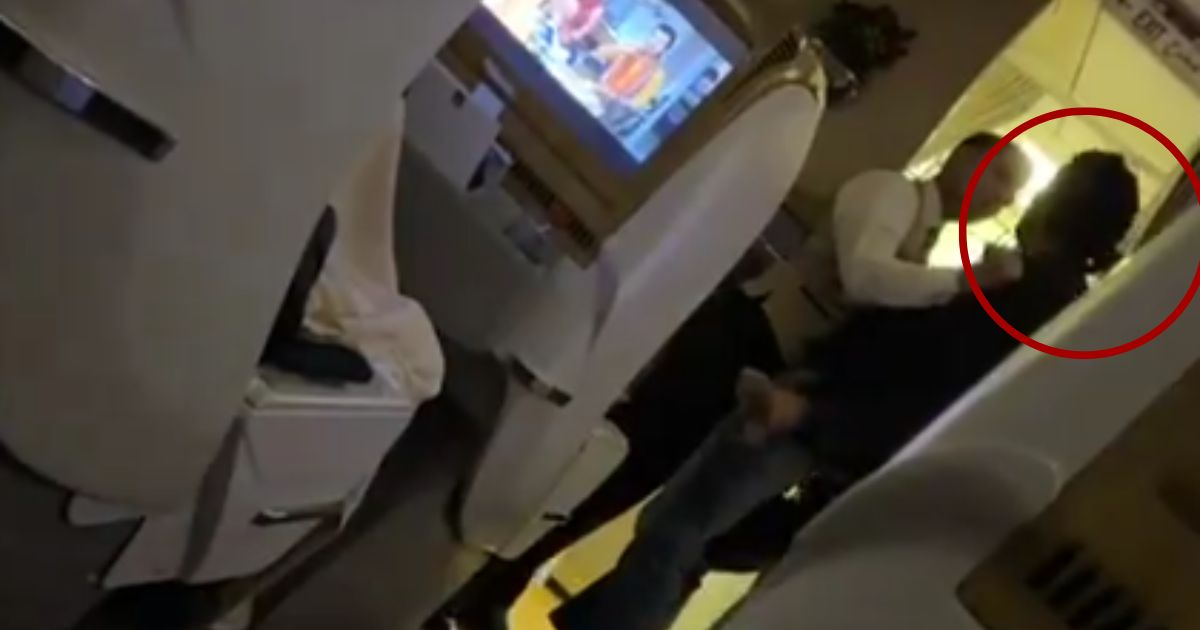 While on a flight from Dubai to Islamabad on Sunday, a male passenger, right, assaulted a flight attendant and was promptly restrained by crew members.