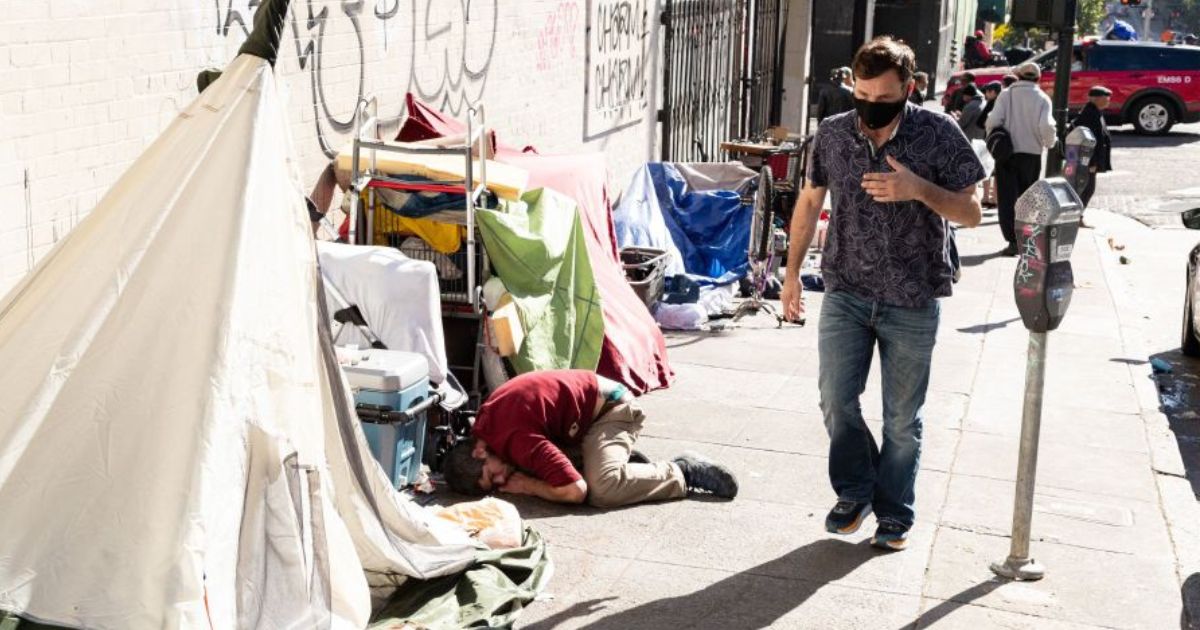 People and their belongings are seen on Jones Street in San Francisco, Nov. 13, 2023.