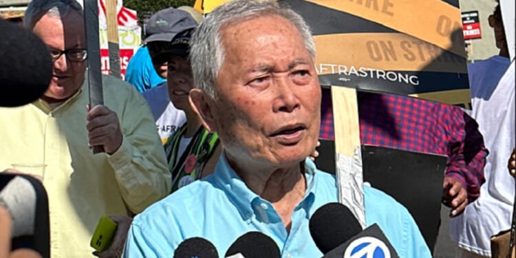 Actor George Takei, pictured in a September file photo from an actors' union picket line.