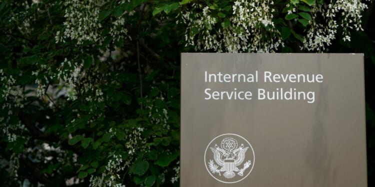 A sign for the Internal Revenue Service building in Washington, D.C., is shown.