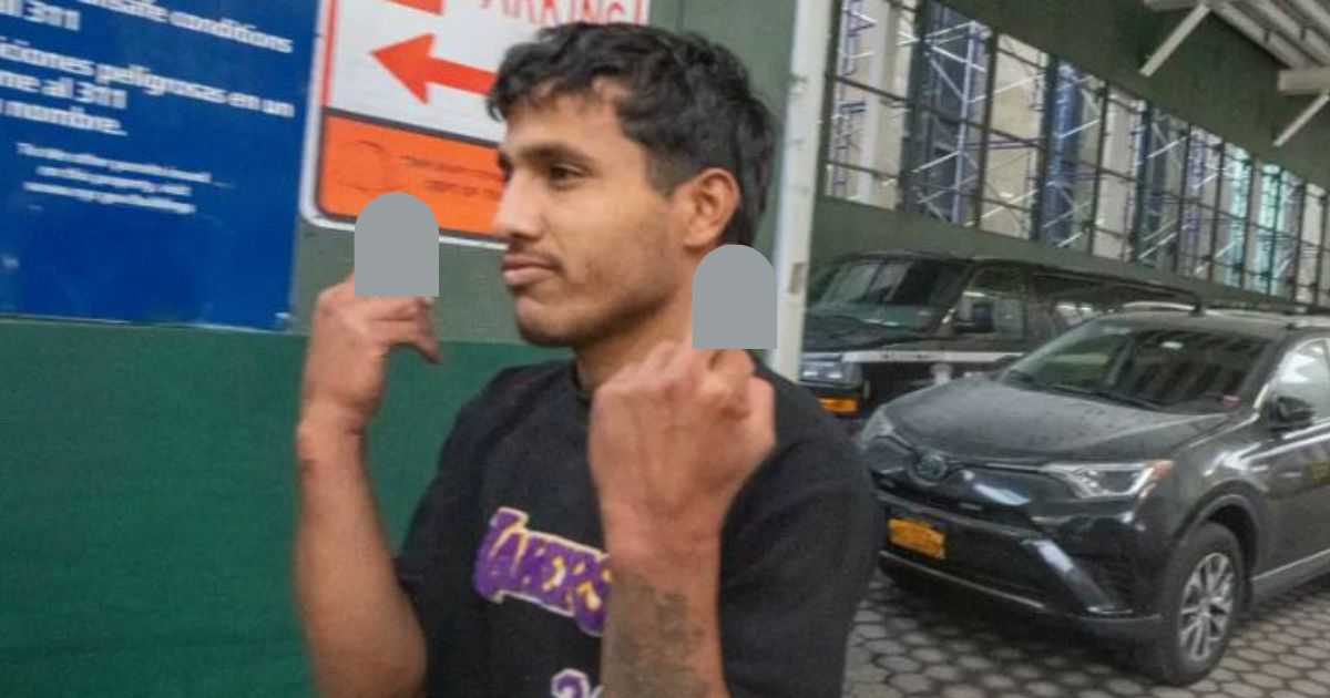 One of the five men charged with attacking two NYPD officers in Times Square "saluted" onlookers upon leaving court.