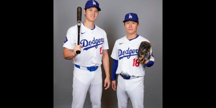 Los Angeles Dodgers designated hitter Shohei Ohtani, left, and starting pitcher Yoshinobu Yamamoto pose for a photo during a spring training baseball photo day, Wednesday, in Phoenix.