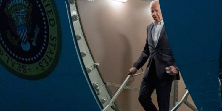 President Joe Biden walks down the ramp of Air Force One as he arrives at Andrews Air Force Base, Maryland, on Thursday.