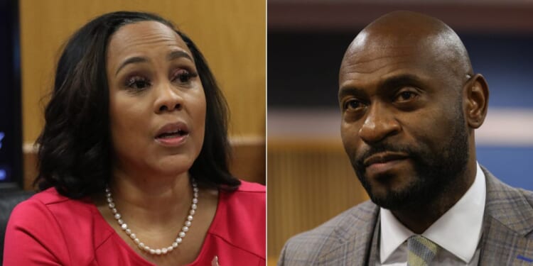 Judge Scott McAfee ruled on Monday that the divorce attorney for Nathan Wade, right, would have to retake the stand in the proceedings to determine if Wade and District Attorney Fani Willis, left, should be disqualified from the case involving former President Donald Trump.